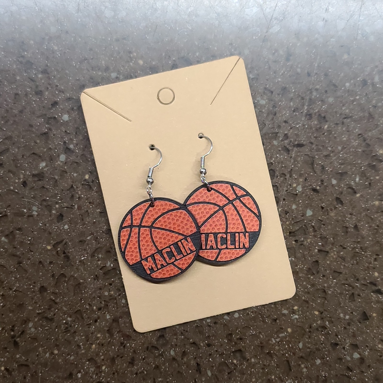 Basketball earrings on a kraft display card