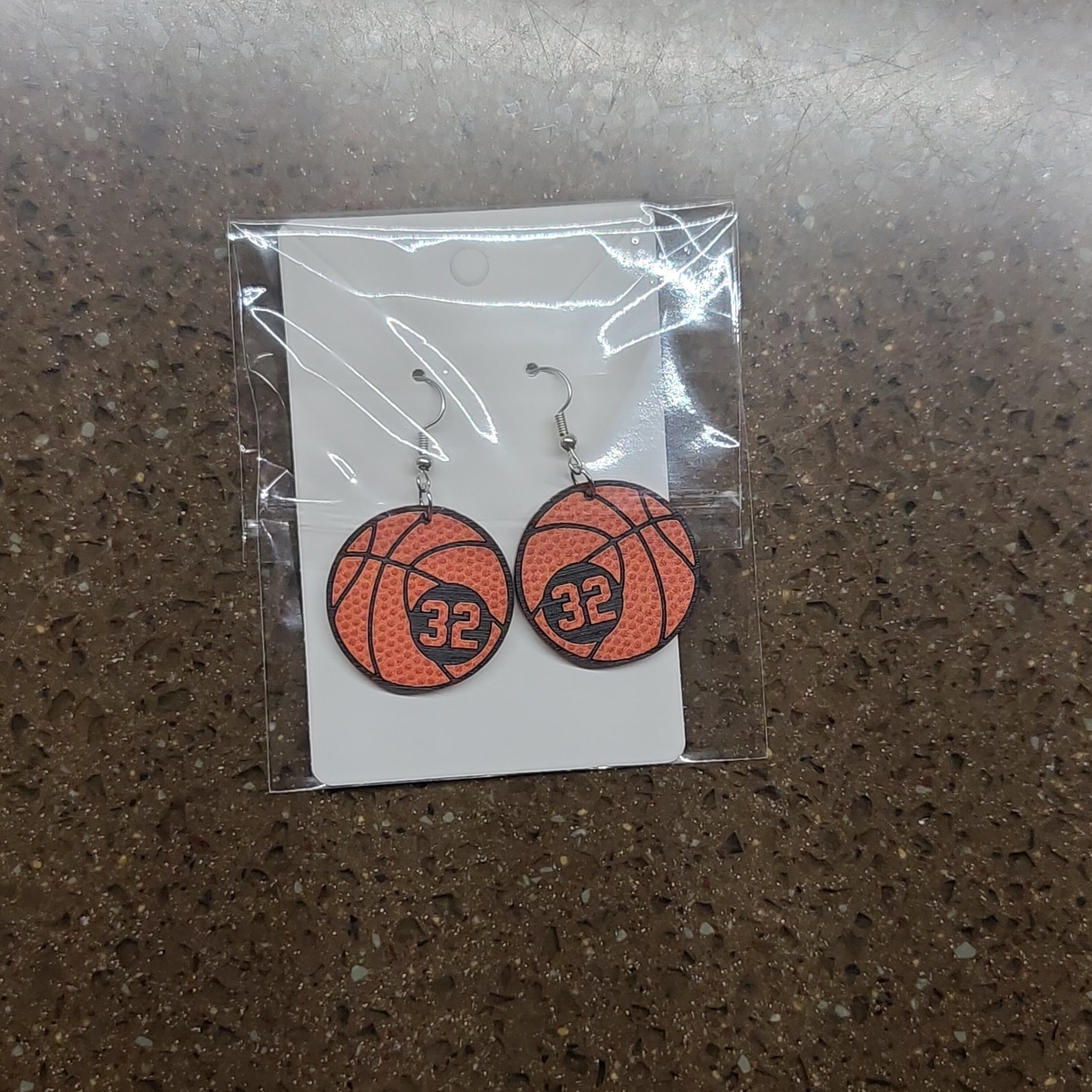 Basketball earrings with jersey numbers 32 and 30